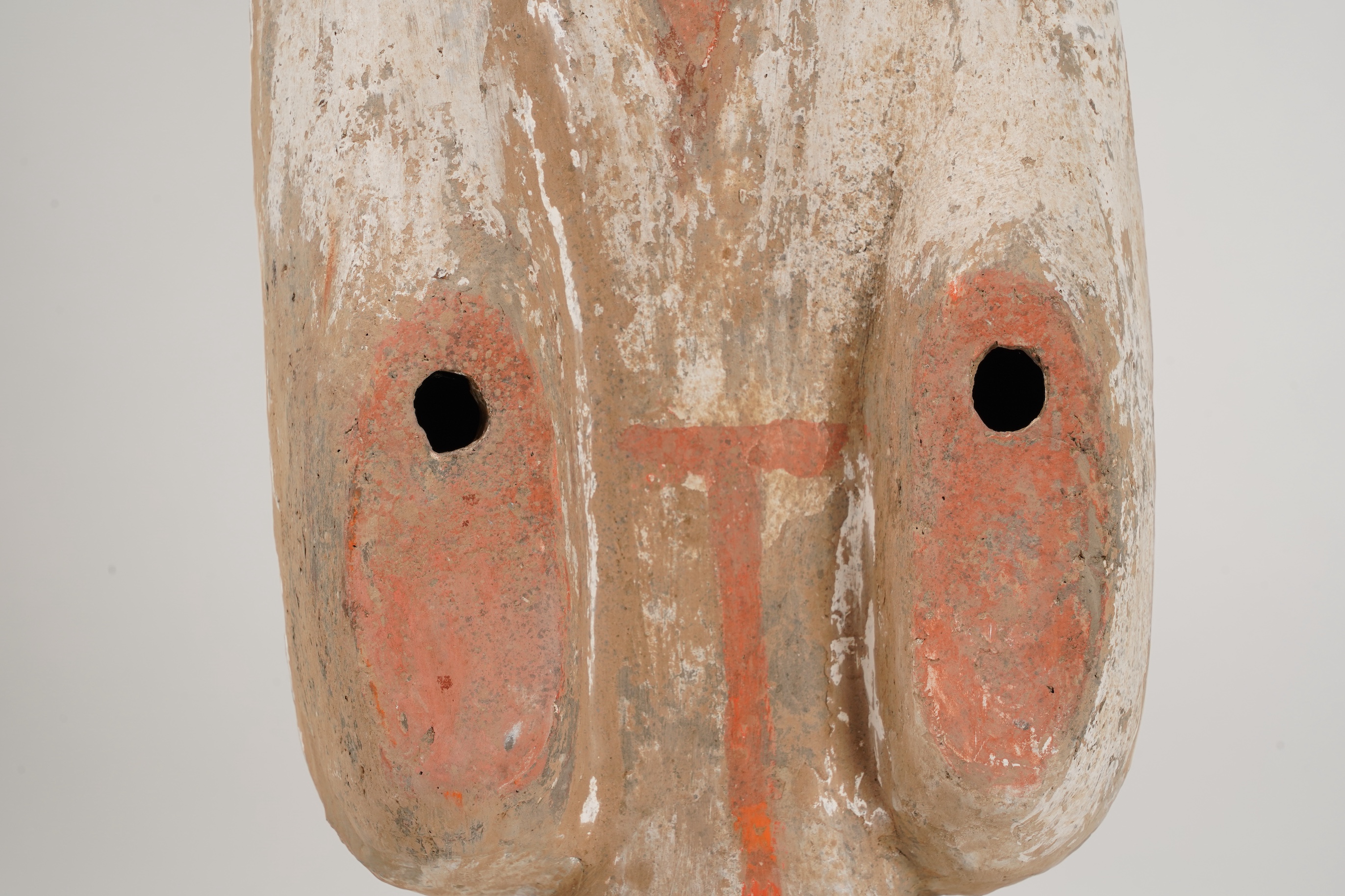 A large Chinese polychrome pottery figure of a female attendant, Han dynasty or later